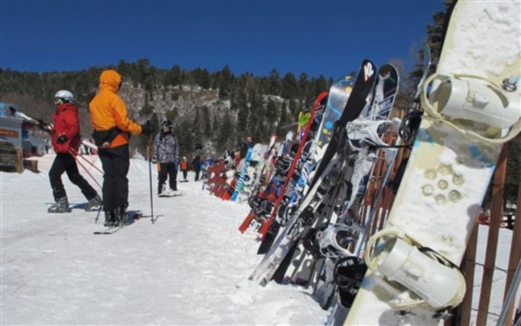 Skiers heading toward the slopes at Sandia Peak Ski Area near Albuquerque, N.M. in March. New Mexico, traditionally warmer and with less reliable snowfall than its northern neighbors, this weekend celebrates the end of an unexpectedly good season that overcame forecasts of drought. 